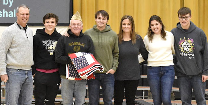 Ed Sullivan was the recipient of the 'Quilt of Valor' that was presented on Nov. 11 at the Woodbine Veterans Day Ceremony.  He is shown with his family, from left, Ryan Sullivan, Brenner Sulllivan, Ed Sullivan, Connor Sullivan, Tina Sullivan, Shawn Sullivan, and Breck Sullivan.