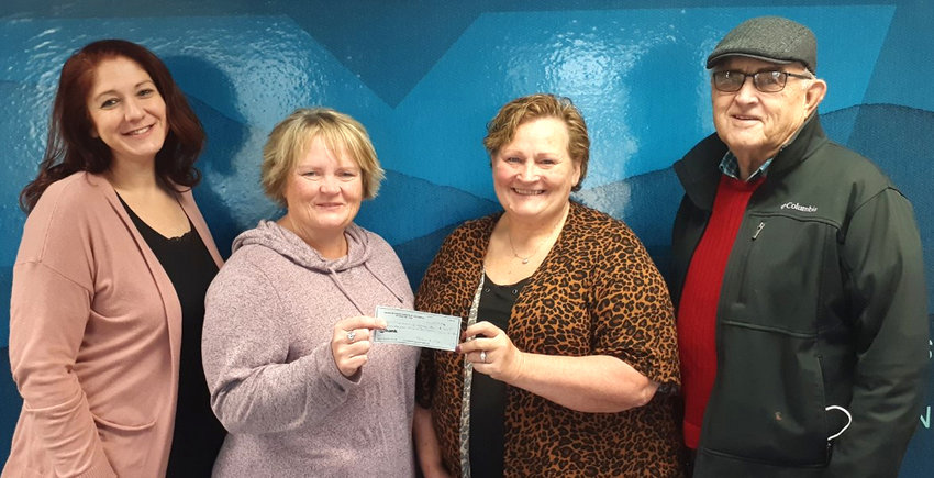 From left, Melanie Black, Trivium Life Services Residential Team Coordinator; Lora Jensen, Market Director; and Juanita Parsons, Residential Team Coordinator accepted the donation from Marvin Maly, Knights of Columbus Treasurer.
