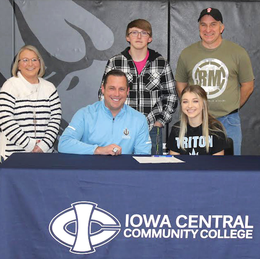 West Harrison senior Zoe Etter (front, right) signed her letter of intent on Dec. 21 to continue cheerleading at Iowa Central Community College in Fort Dodge starting in the fall of 2022.  She is shown in the front row with West Harrison cheer coach Missy Etter, Iowa Central Cheer Coach Mitch Muphy, and Zoe Etter.  Standing in back, Caden Etter and Marc Etter.