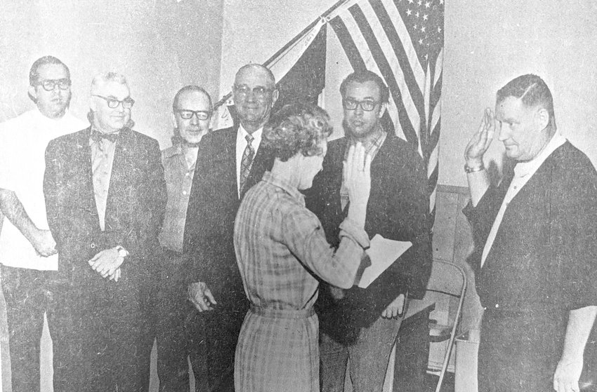 Town Clerk, Laura Naulteus swears in Mapleton's new Mayor, Don (Smiley) Thiel, in a special ceremony. Members of the council looking on are left to right: Grant Scoles, Charles Griffin, Rich Knuth, Ralph Habinck, and Dennis Reed.