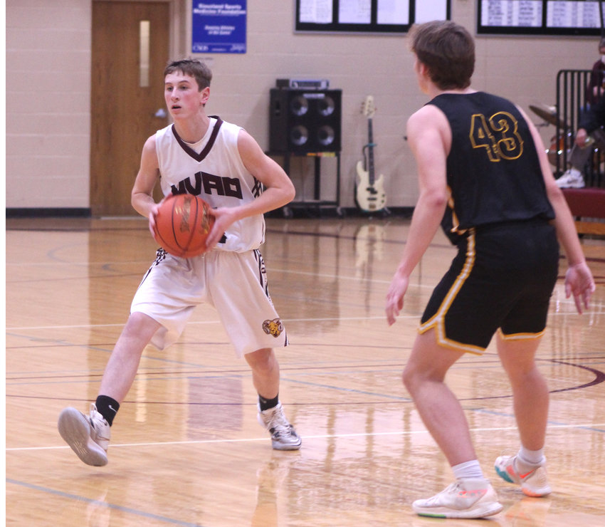 Peyton Gress looks for an open teammate as the Rams faced Kingsley-Pierson.