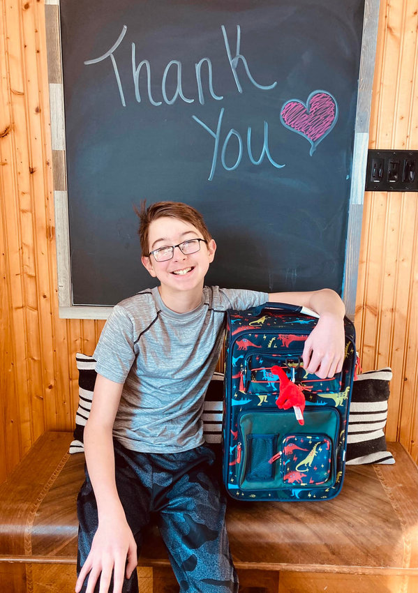 Cooper Mace and his family are collecting new suitcases to be given to children in foster care.