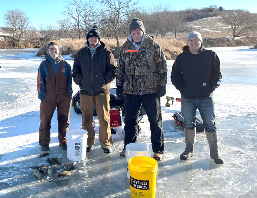 Shania Goslar, Bradley Goslar, Andrew O'Neal, and Mike Wooster get ready for the Monona County Fair Ice Fishing Tournament on Jan. 22..