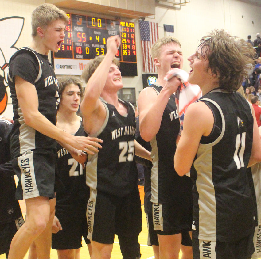 West Harrison's Brady Melby, Nolan Birdsall, Walker Rife, Koleson Evans and Mason King celebrate the Hawkeyes first Boys State Basketball Tournament berth in school history.  West Harrison upset #4 AHTSW (Avoca), 59-55, in the Class 1A Substate 8 Final on Feb. 26 at Thomas Jefferson High School iin Council Bluffs.