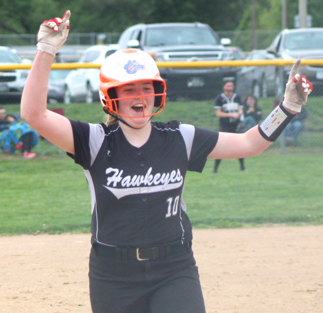 West Harrison's Rylee Evans celebrates her first career home run in Rolling Valley Conference play at Woodbine on May 23.