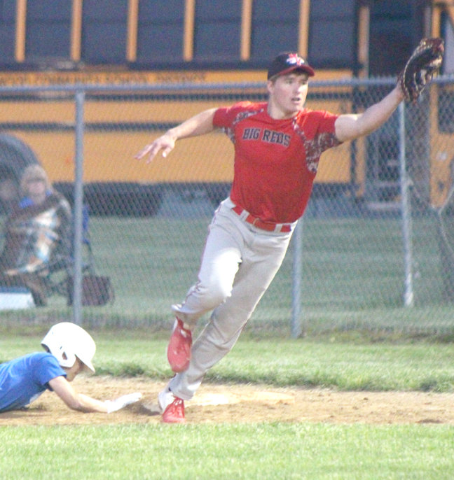 Missouri Valley's Gage Clausen stretches for the throw in Western Iowa Conference action on May 26.