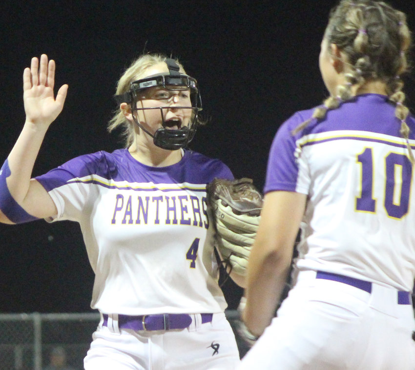 Logan-Magnolia's Marki Bertelsen and Abby Hiatt (10) celebrate the Panthers one-run win at Missouri Valley on June 2 in Western iowa Conference play.