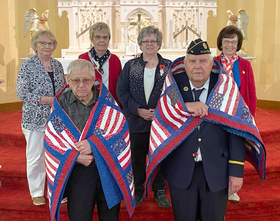 The St. John's LWML presented two Quilts of Valor on Sunday, May 29 during a special Memorial Day church service. Donald Kragel and Jerry Jors, pictured in front, each received a Quilt of Valor. Pictured in the back are Jeanne Kuhlmann, Karen Weiss, Linda Kuhlmann, and Marjorie Neddermeyer.