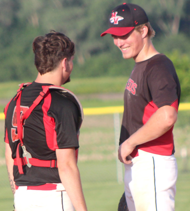 Missouri Valley's Gage Clausen (right) and Kadin Bonham share a laugh in between innings during the Western Iowa Conference battle on June 16 in Logan.