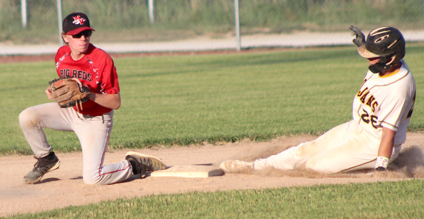 Missouri Valley's Brad Ortner completes the force out in Western Iowa Conference play on June 23.  The Big Reds open Class 2A District Tournament play on July 2.