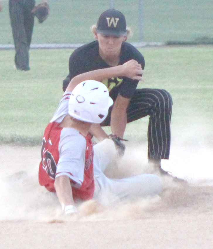 Woodbine's Kylon Reisz places the tag on the Missouri Valley baserunner in the Tigers victory in the regular seaosn finale at Missouiri Valley.