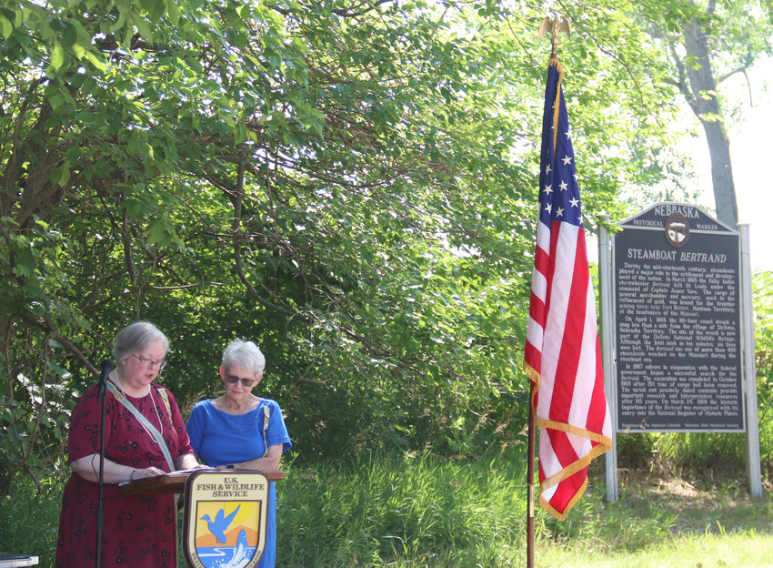 Nebraska Daughters of American Colonists State Regent Kathy Ocasio, left, and Anne Reim, State Vice Regent, read a rededication pledge for the Steamboat Bertrand marker at DeSoto National Wildlife Refuge on July 9. The DAC and DeSoto employees conducted a rededication ceremony for the marker in honor of its 50th anniversary.