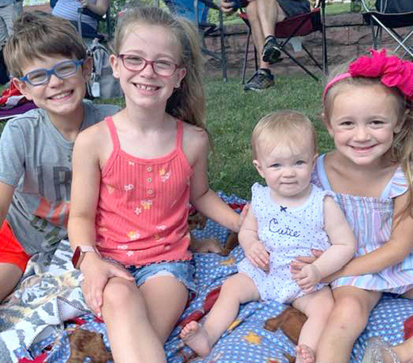 Enjoying the 2022 Woodine Rodeo parade on July 9 include, from left, Cody Smith, Sadie Smith, Charlotte Smith, and Jolie Smith.
