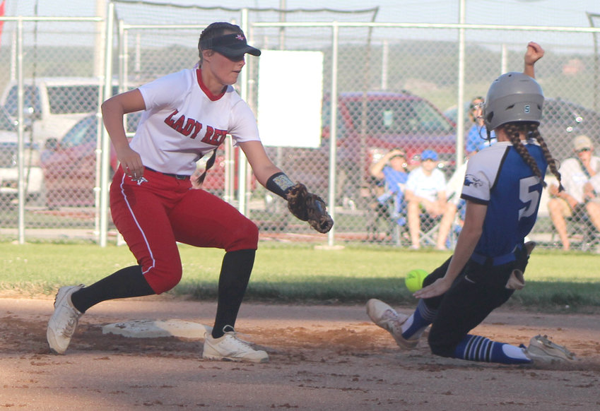 Missouri Valley's Emma Gute places the tag on the advancing baserunner in the Class 2A District Final on July 1 at Missouri Valley.
