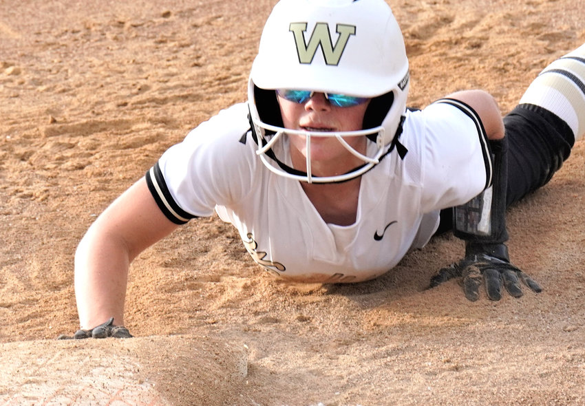 Woodbine's Charlie Pryor slides safely into the bag during the Class 1A Regional Semifinal win over Boyer Valley.  The Tigers played in their first Regional Final on July 11 since 2011.