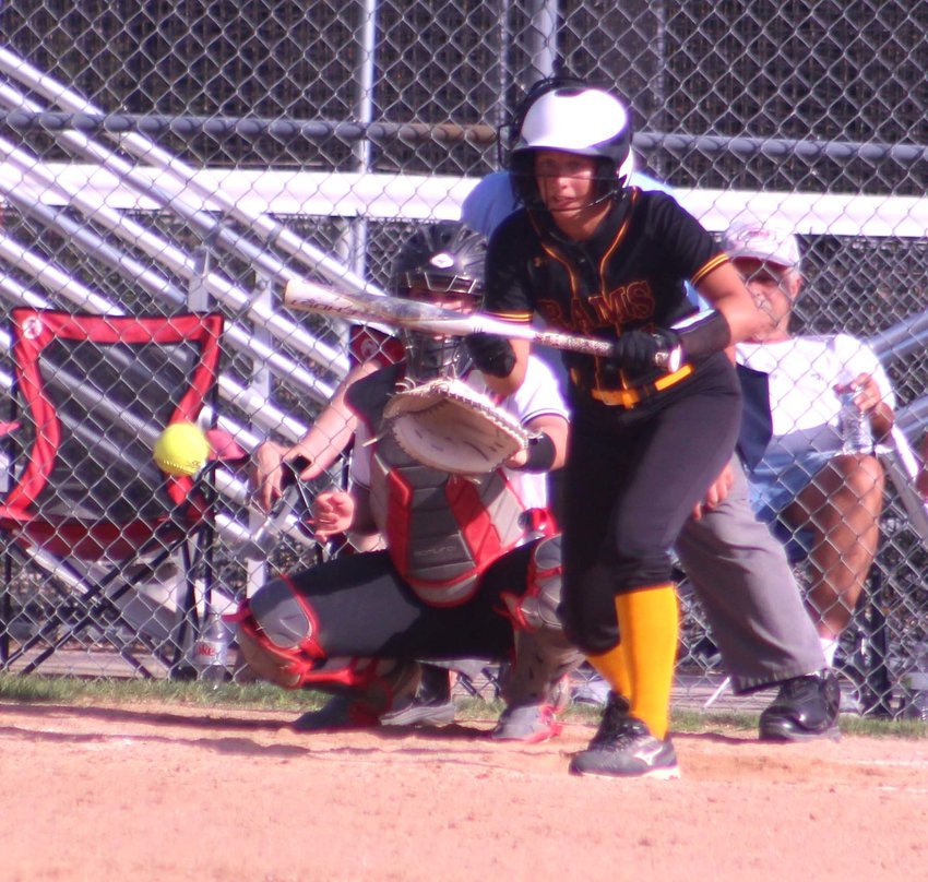 Sidney Trucke lay down a perfect butt to score a run for the Rams against East Sac County in the regional quarterfinals on July 6.