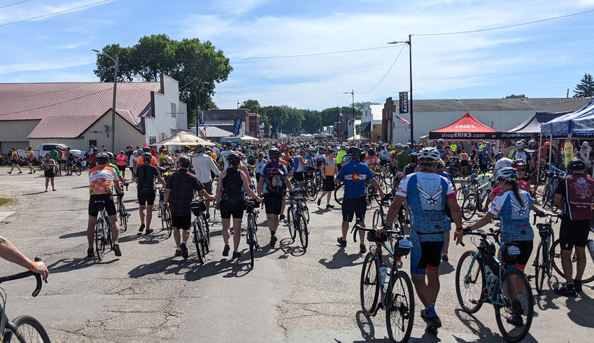 RAGBRAI riders make their way down Main Street in Anthon on Sunday, July 24.