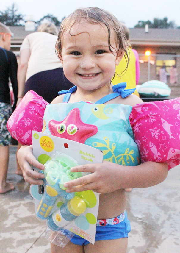 MaKyndra Gakle was happy with the prize she received at the pool party this past weekend in Logan.