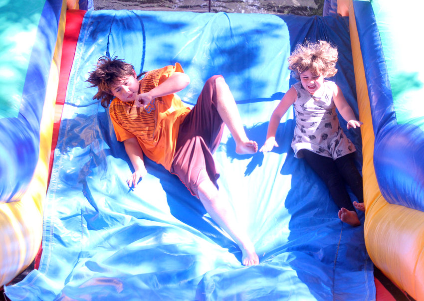 These kids enjoyed sliding down the obstacle course during Ute Fun Days last year.
