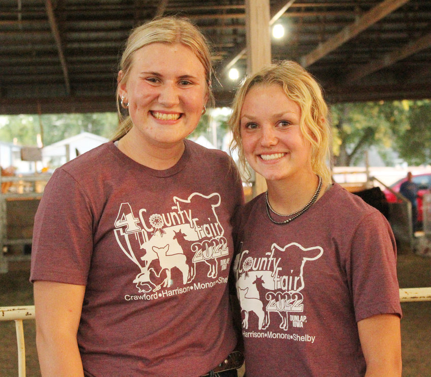 Here Showman of Showman Champion Mabel Langel (left) and Showman of Showman reserve Champion Brylie Anderson (right) stand for a photo.