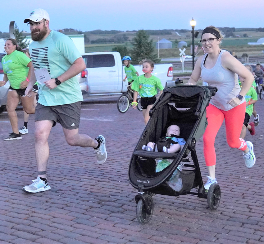 Nick, Shelby and Holden Fly get a quick start at the 2022 Woodbine Glow Run on Aug. 12 in Woodbine.