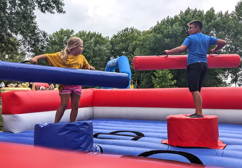 These two kids battled in the inflatable Gladiator Jousting run during Ute Fun Days.