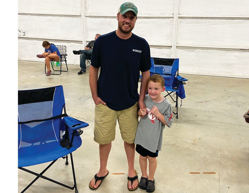 Ryan Denton (left) hopes Cub Scouts will have a positive impact on his son Daxton.