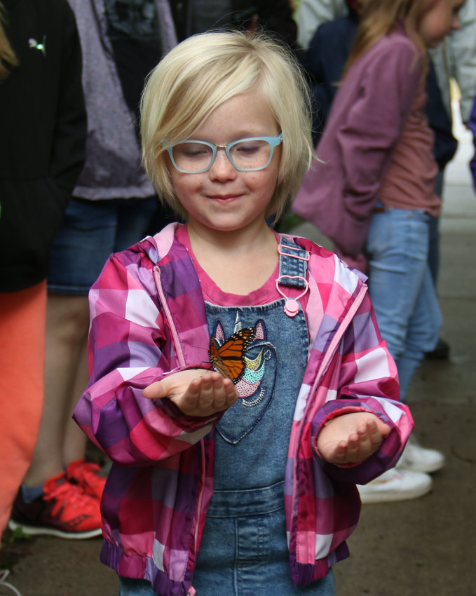 Annorah Urban, 5, proudly looks at a Monarch butterfly she helped tag at DeSoto National Wildlife Refuge on Sept. 10. Guests were invited to the nature center to learn more about Monarchs before tagging and releasing them in the park.
