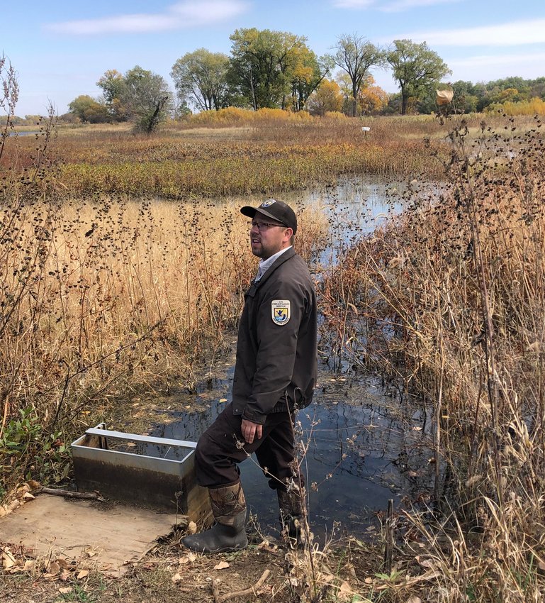 DeSoto National Wlidlife Refuge park ranger Peter Rea explains how park employees help prep the DeSoto wetlands for the fall waterfowl migration during a series of wetland walks on Oct. 15.