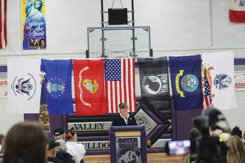 The American flag, POW-MIA flag, and the flags of five of the six branches of the military (no Space Force) provided the backdrop for guest speaker Jennifer Miller of American Legion Post 224.