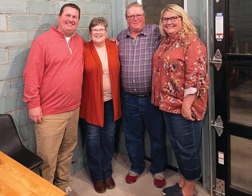 Paula Riester celebrated her retirement from the Town and Country Store, owned by Brad and Lisa Gross, last Thursday. Pictured from left to right: Brad Gross, Paula Riester, Mike Riester, and Lisa Gross.