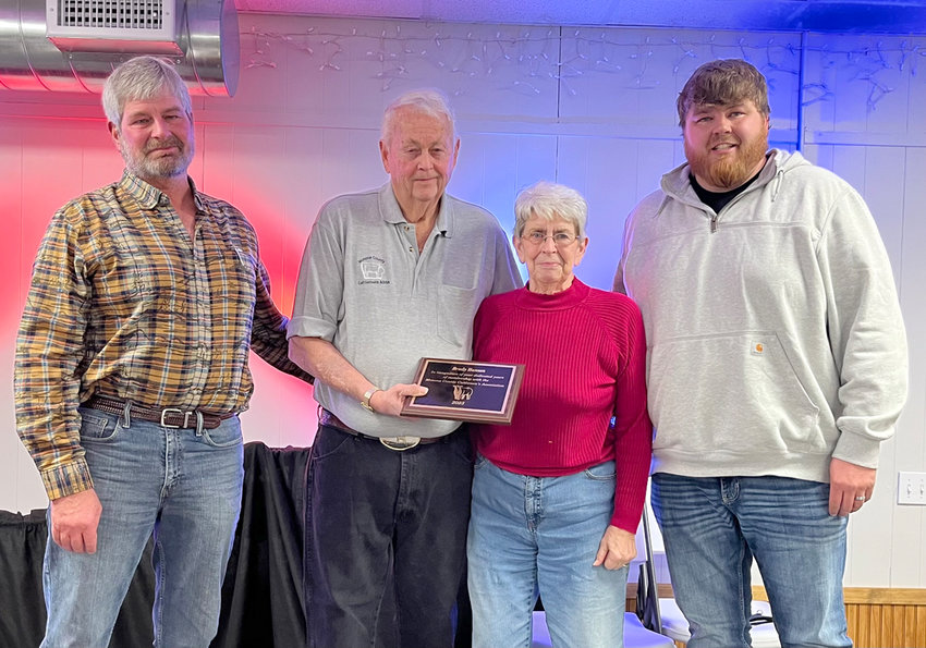 The family of Brady Hanson presented a special award for his years of contributions as a member to the association. Pictured are Brad Hanson, Vice President Bob Otto, Cathy Hanson, and Beau Hanson.