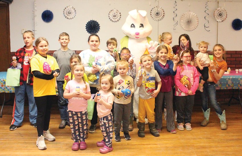 All the individuals from preschool age to adulthood that participated in the annual Hop into Spring egg decoration contest got a group photo with the Easter Bunny.