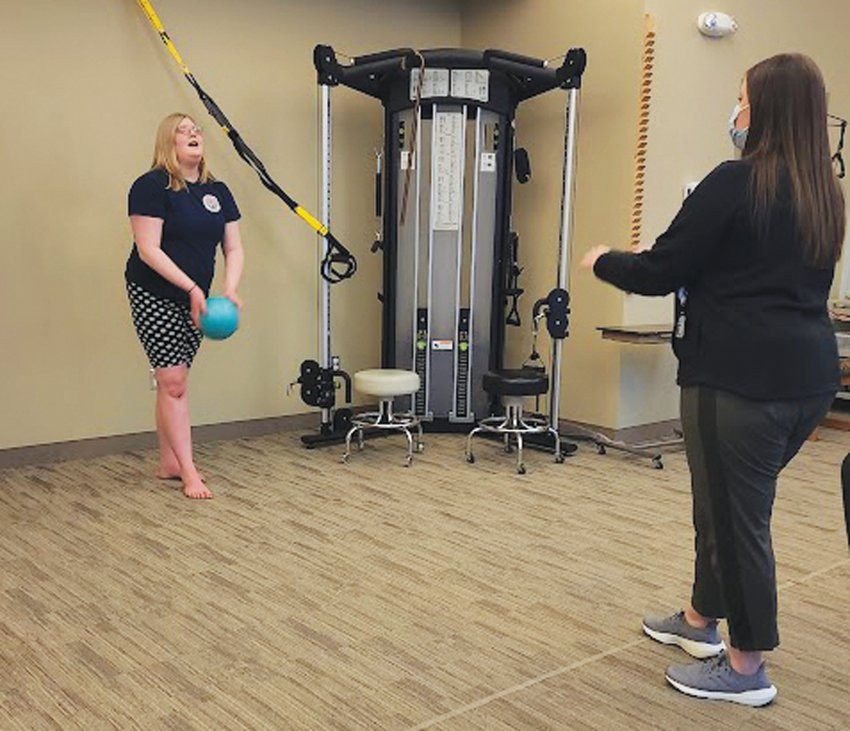 Katie Hoskins, left, belts out &ldquo;Easy On Me&rdquo; by Adele during her physical therapy session with CHI Health Woodbine Clinic Therapist Marissa Knott. The 14-year-old Hoskins recently returned to Iowa after receiving a double lung transplant in Texas. With April being deemed as National Donate Life Month, Katie is sharing her story.