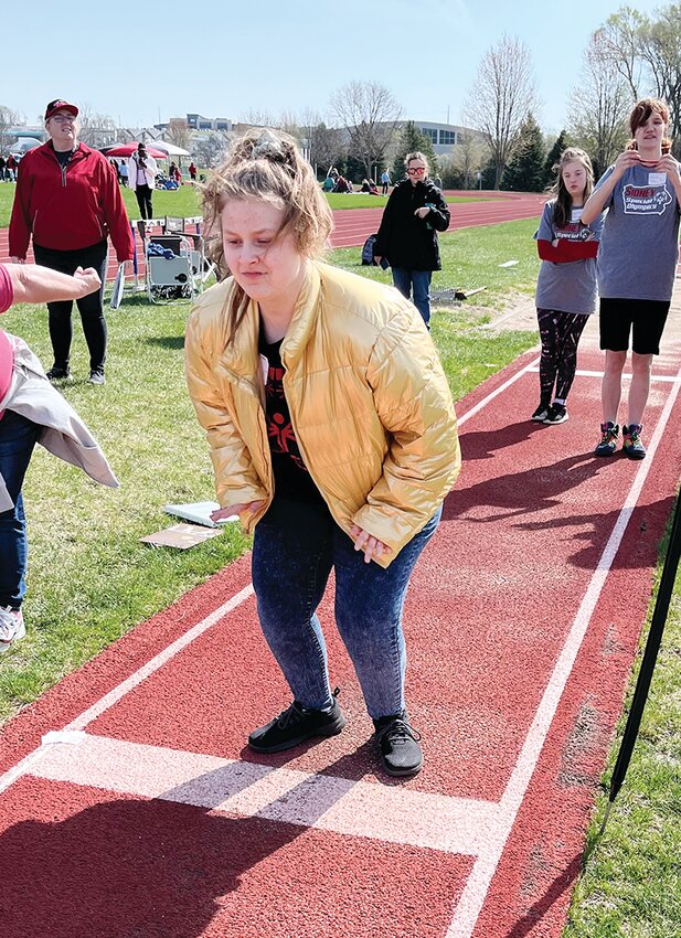 Isis Leisy puts her all into her event during the Special Olympics track competition held at Iowa Western Community College on April 18.