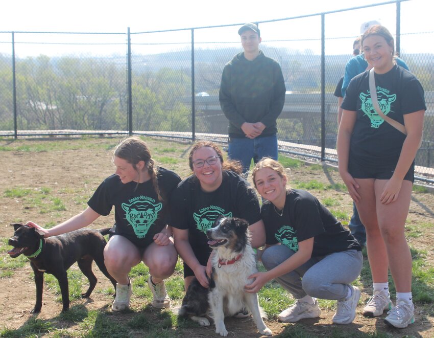 Pictured at the Harrison County Humane Society, from left: Sirus (dog), Ava Sloan, Alivia Leonard, Merle (dog), Bella Rosengren and Addyson Gustafson.