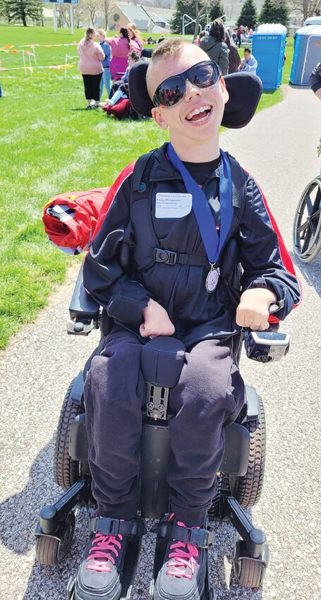 Kasey Christensen is in 11th grade and loves the Kansas City Chiefs and going to figure-8 races. Kasey will be competing in the 100 M motorized wheelchair race at this year's competition.