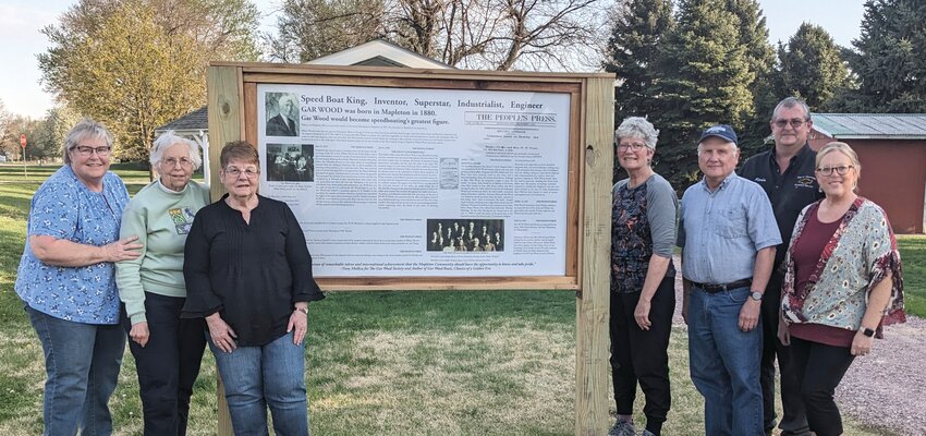 The Mapleton Rotary Club placed an informational sign about Gar Wood at the Rotary Roadside Park along Hwy 141. Pictured are Rotary members Dian Bleil, Marlene Phillips, Judy Martin, Jeanie Theobald, Keith Robinson, Kevin Goslar and Jennifer Goslar.