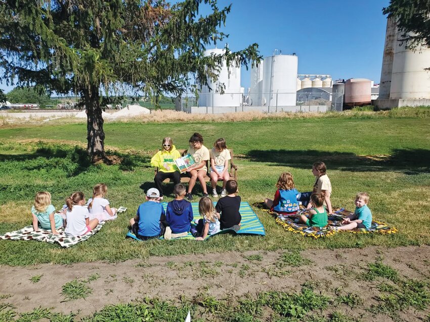 The Dunlap Community Garden hosted a Kid's Day on Monday. Pictured is the &quot;storytime&quot; portion of the event.