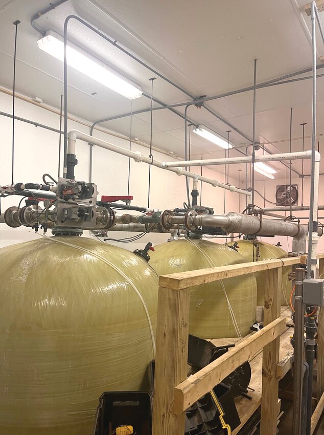 This is some of the treatment equipment inside the water treatment plant. This is basically a giant water softener. When 160,000 gallons of water runs through each of these filters, they are backwashed with a salt brine to clean them. What comes out is something that looks like thick egg shells. You think the water in your home is hard, image it without these working. The valves on top are worn out and need to be replaced. That will happen soon.