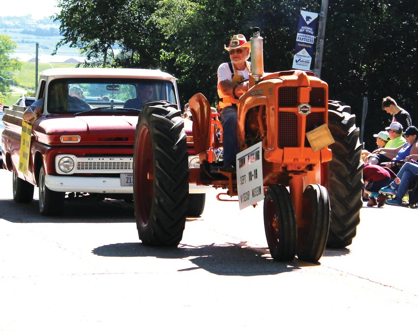 The late Charlie Wisecup drove an antique tractor in the 2021 Magnolia Old Settlers parade on Saturday, Aug. 21.