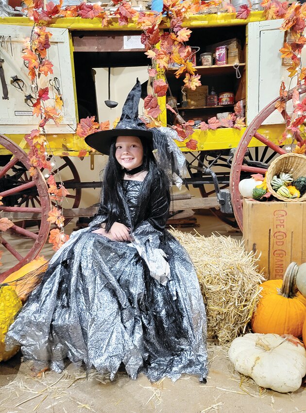 The Harrison County Iowa Welcome Center hosted its annual trick-or-treat event on Oct. 19. The event included trick or treating, a farmers&rsquo; market and a photo background. Here the black witch Peyton Nelson stopped to pose for a photo.