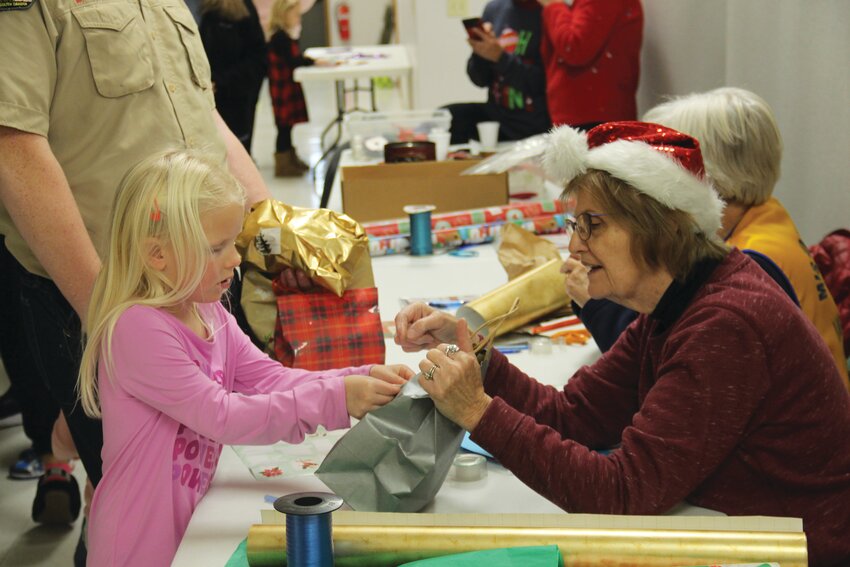Lots of shopping was done by kids at the Little Christmas Store, which provides opportunities for little ones to pick out gifts for relatives.