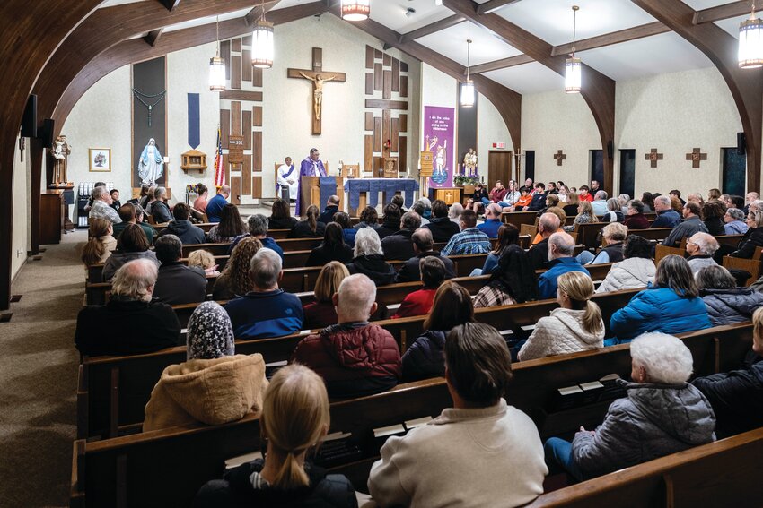 Many parishioners attended a Sunday evening prayer service for Fr. Stephen Gutgsell at St. John the Baptist Catholic Church.