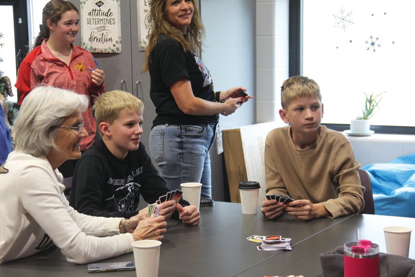 Boyer Valley students play UNO with members of the community last Friday.