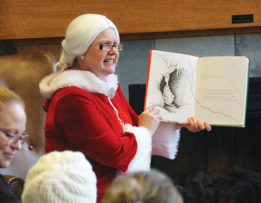 Mrs. Claus read &quot;How the Grinch Stole Christmas&quot; to children at the Missouri Valley Public Library on Wednesday, Dec. 13.