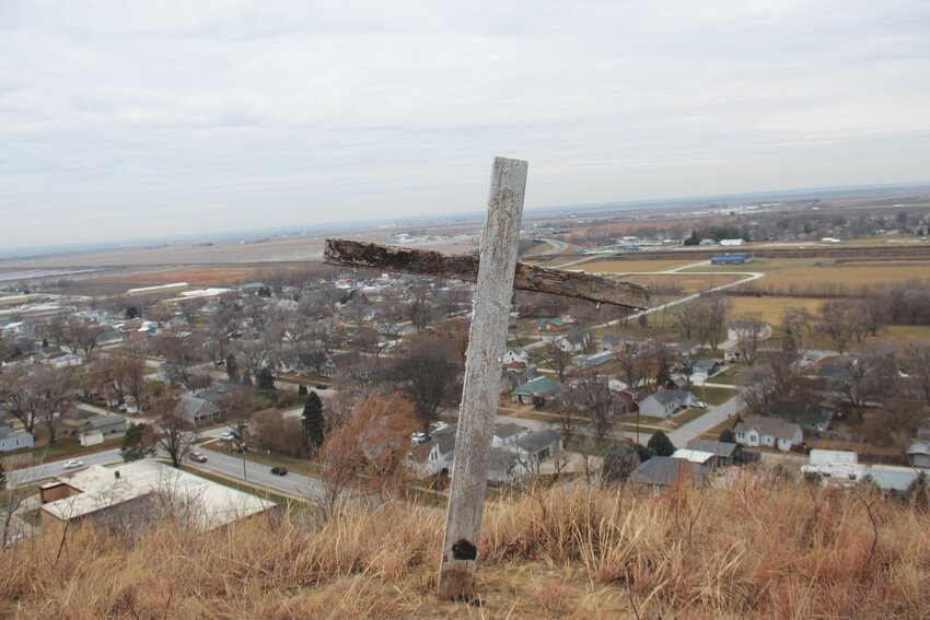 Mark K. Smith erected a cross on a bluff overlooking Missouri Valley to provide hope during the floods of 2019. The MVCSD office is visible in the bottom left.