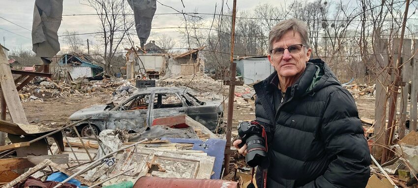 Fr. Jim Kirby stands amidst the rubble of a home that was hit by debris from a Russian drone that had been shot down by Ukrainian air defense in the town of Bortnichi. All members of a family of three were seriously injured.