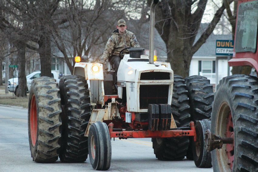 Pat Mumm drives his tractor down Iowa Avenue during Tractor Day in celebration of National Ag Day March 21.