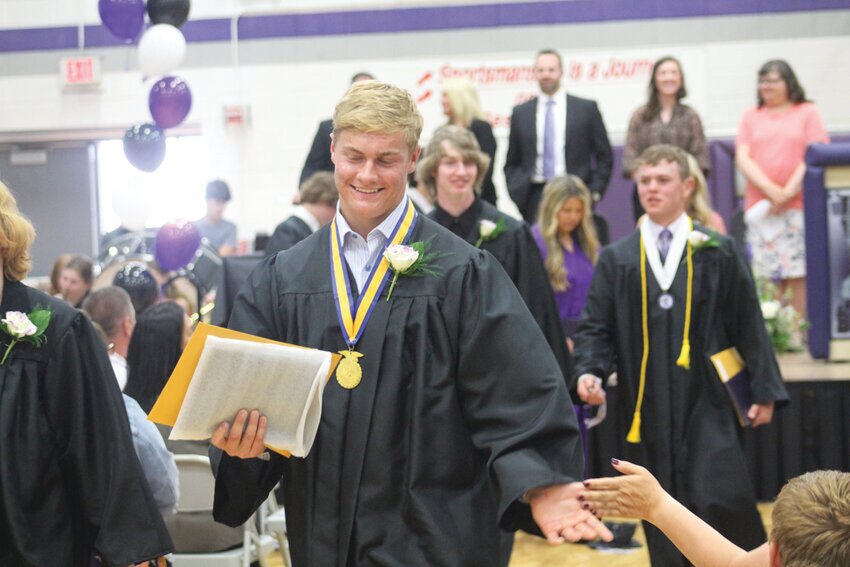Bobby Gross executes a well-earned high five at the end of Boyer Valley's commencement exercises.